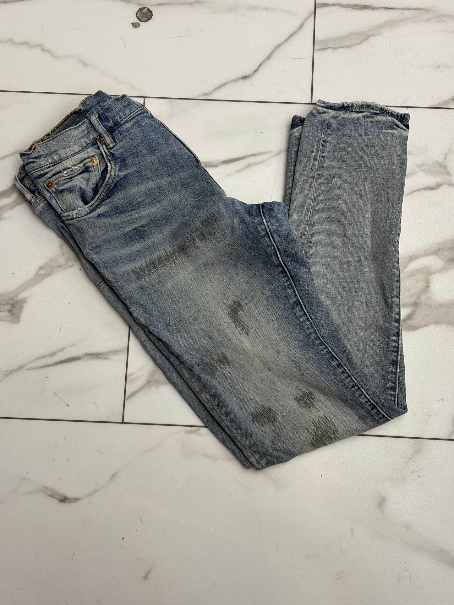 Purple jeans scratched up preowned with back tag