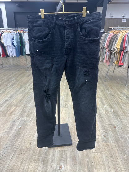 Preowned Black Purple Jean ripped paint splatter with back tag