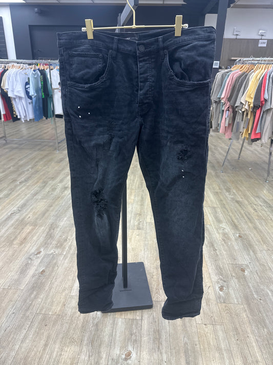 Preowned Black Purple Jean ripped paint splatter with back tag