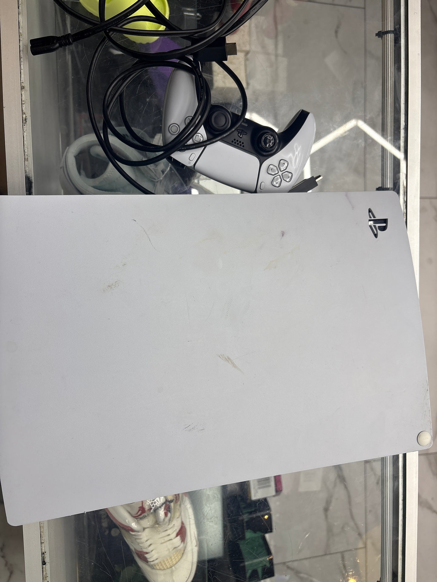 Pre-owned PlayStation 5 with one controller and cables